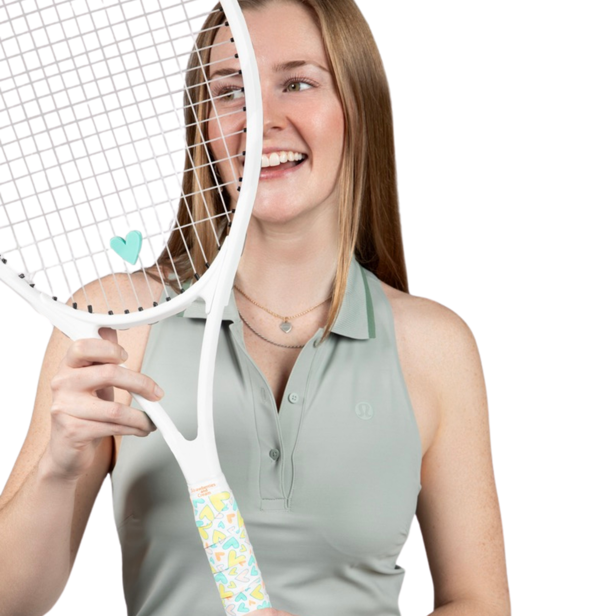 woman holding tennis racket with heart shaped tennis grip and matching dampener