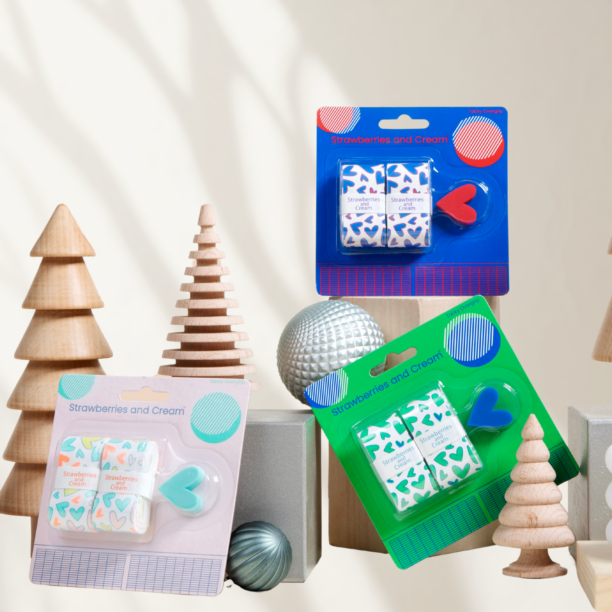 3 heart shape tennis overgrip and shock absorber sets pastel, green and blue in a holiday backdrop
