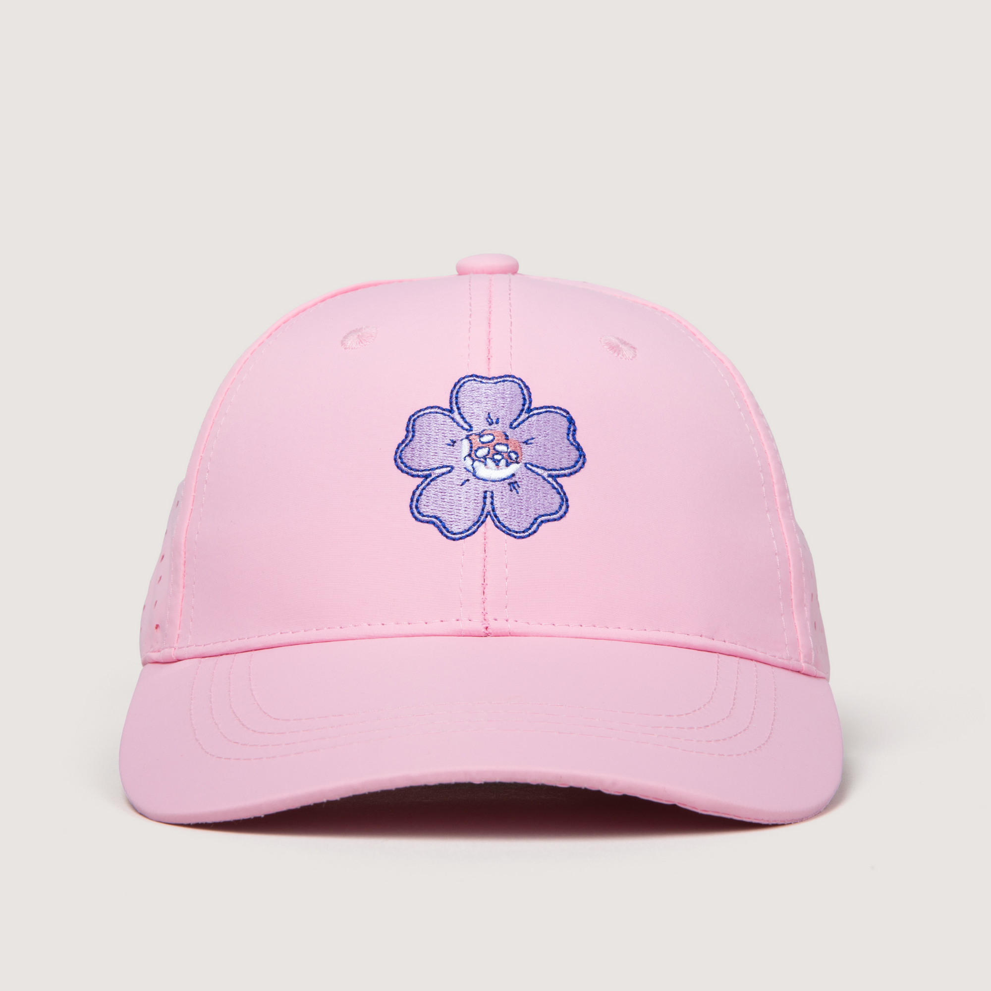 Pink cap with a blue floral design on a light gray background