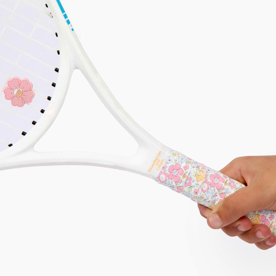 Hand holding racket adorned with The Anneliese Collection Matching Tennis Overgrip and Dampener - Pink